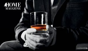 Glass of whiskey in hand