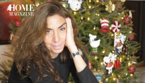 Woman with Christmas tree in background