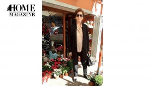 Elegant old woman with sunglasses and suit