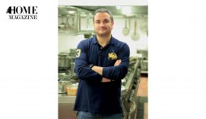 Man wearing navy in kitchen