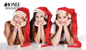 Teenage girls wearing Christmas hats