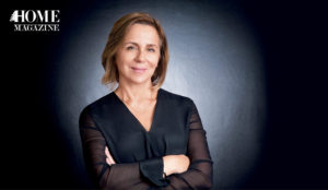 Women smiling in black background and black top