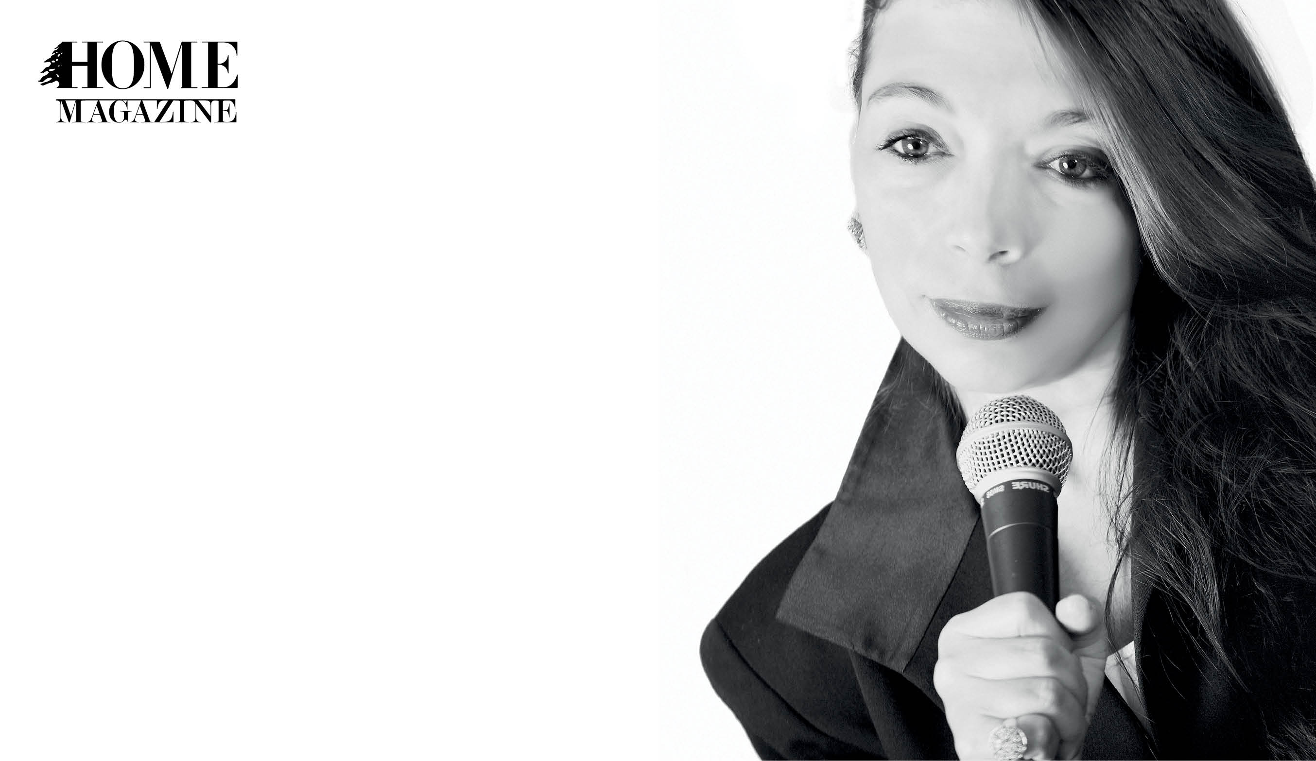 Girl in black shirt and hair to one side holding microphone in hand