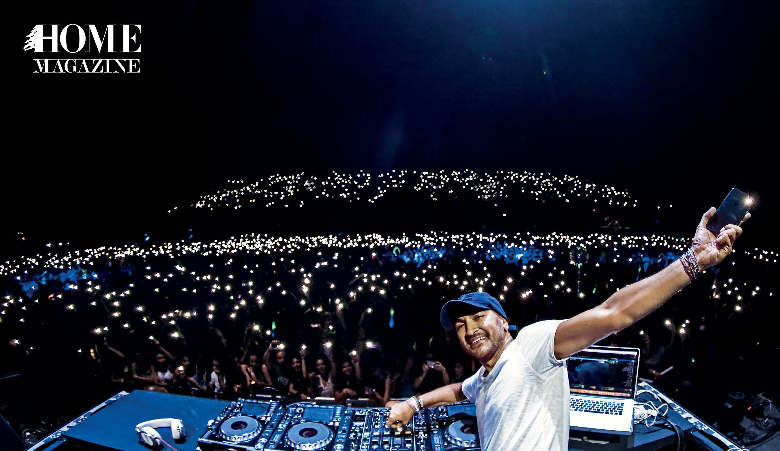 Male DJ with spinning machine and crowd