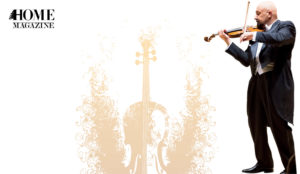 Man wearing black suit playing the violin on yellow-brown violin drawing backgroud