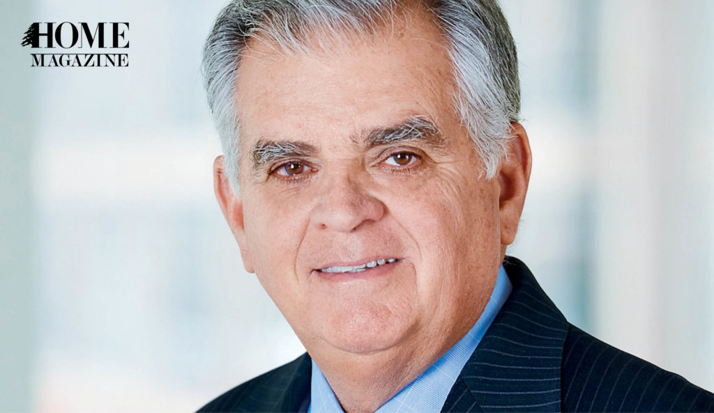 Portrait of man in suit with white hair