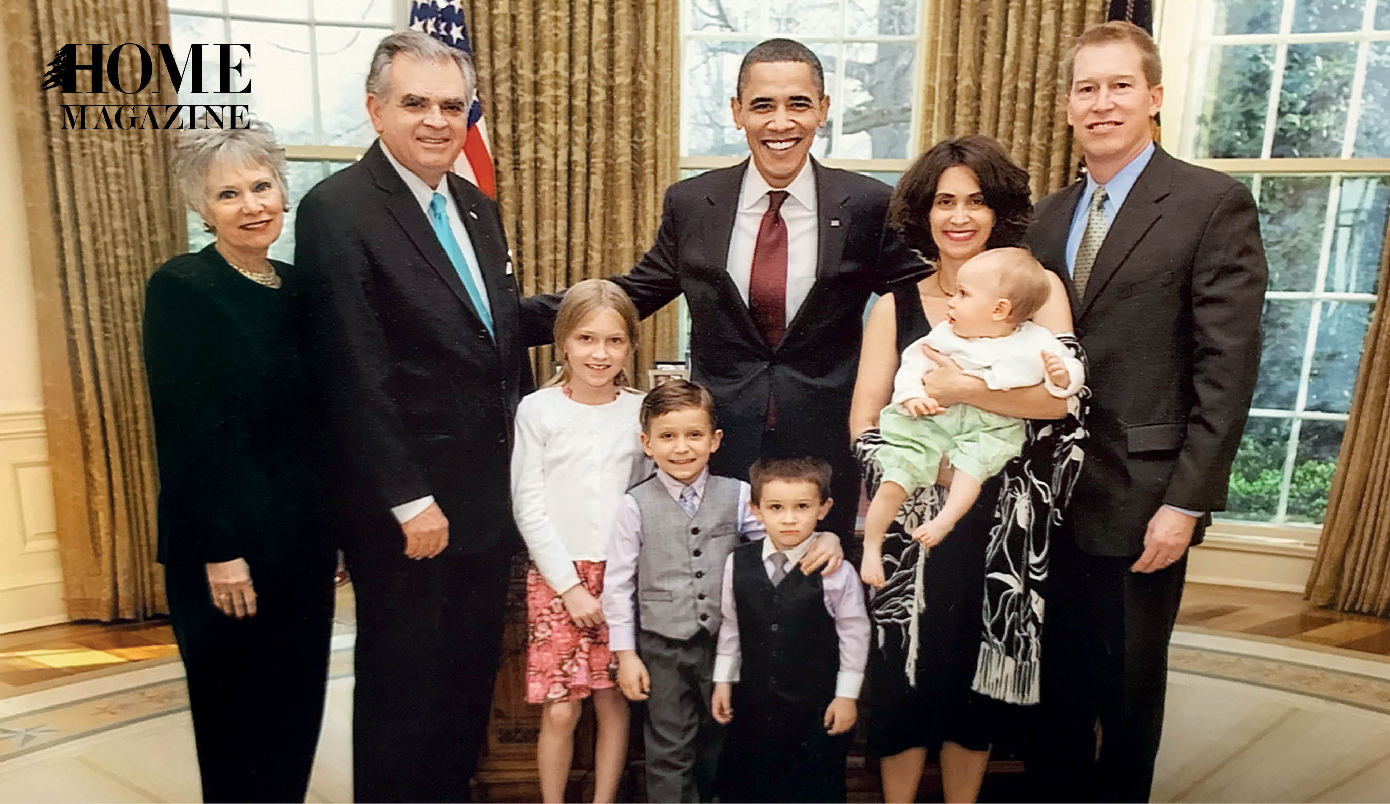 Group picture of three men, two women, and four kids