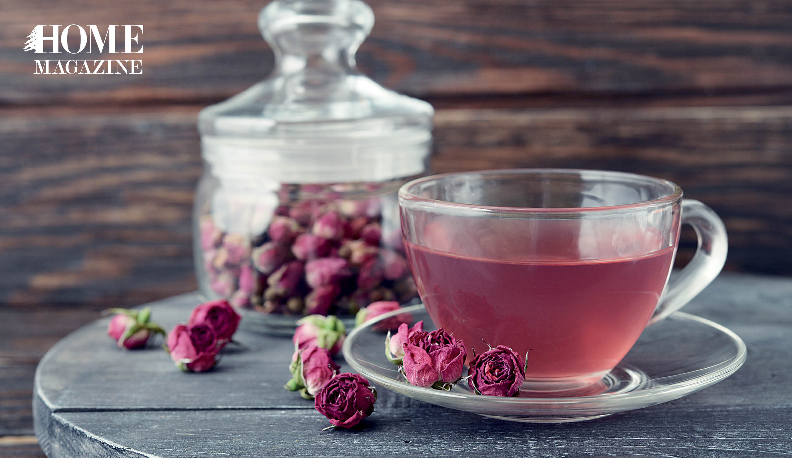 Pink roses with pink fluid in a cup