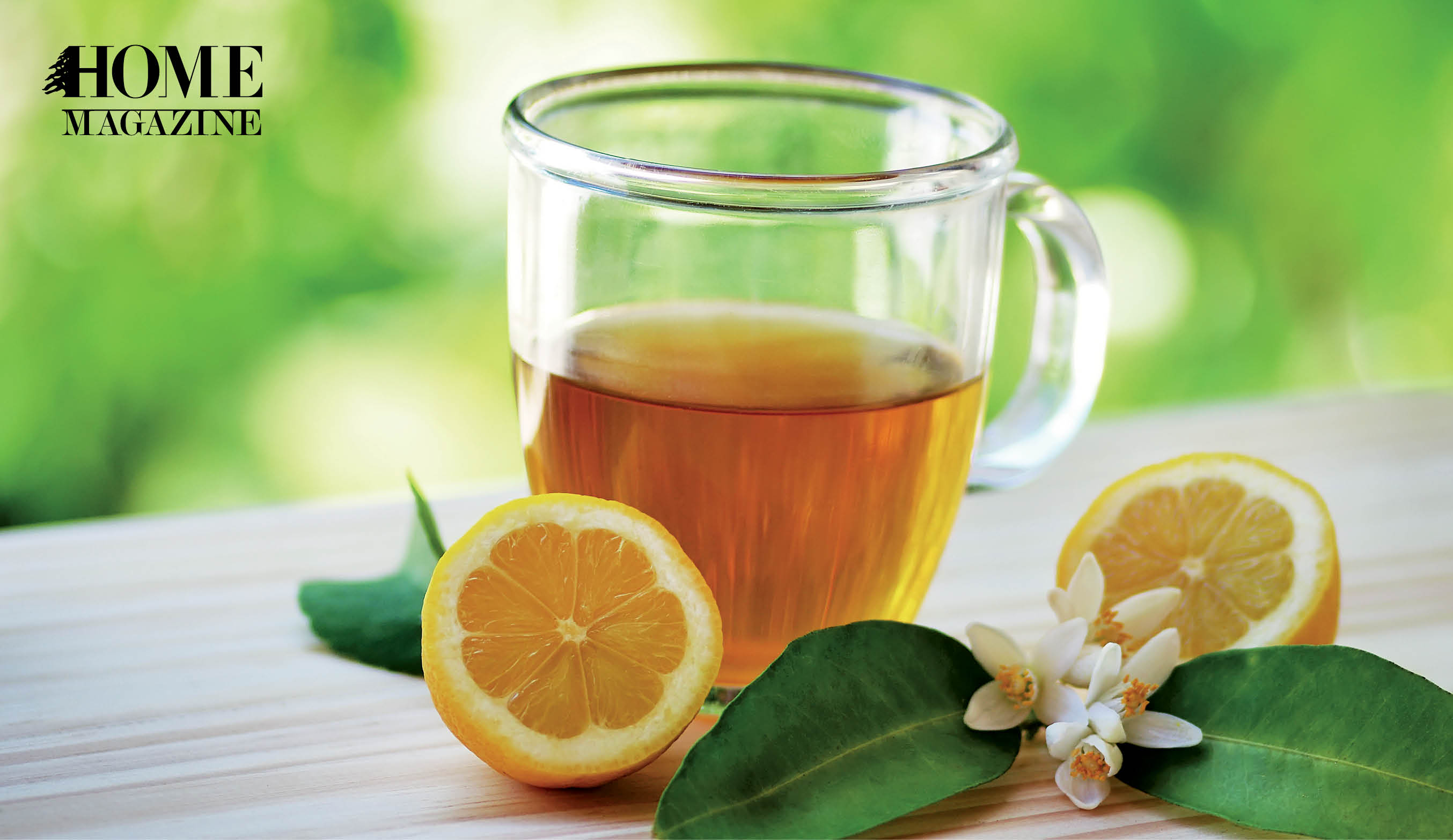 Orange fluid in a cup with orange fruit