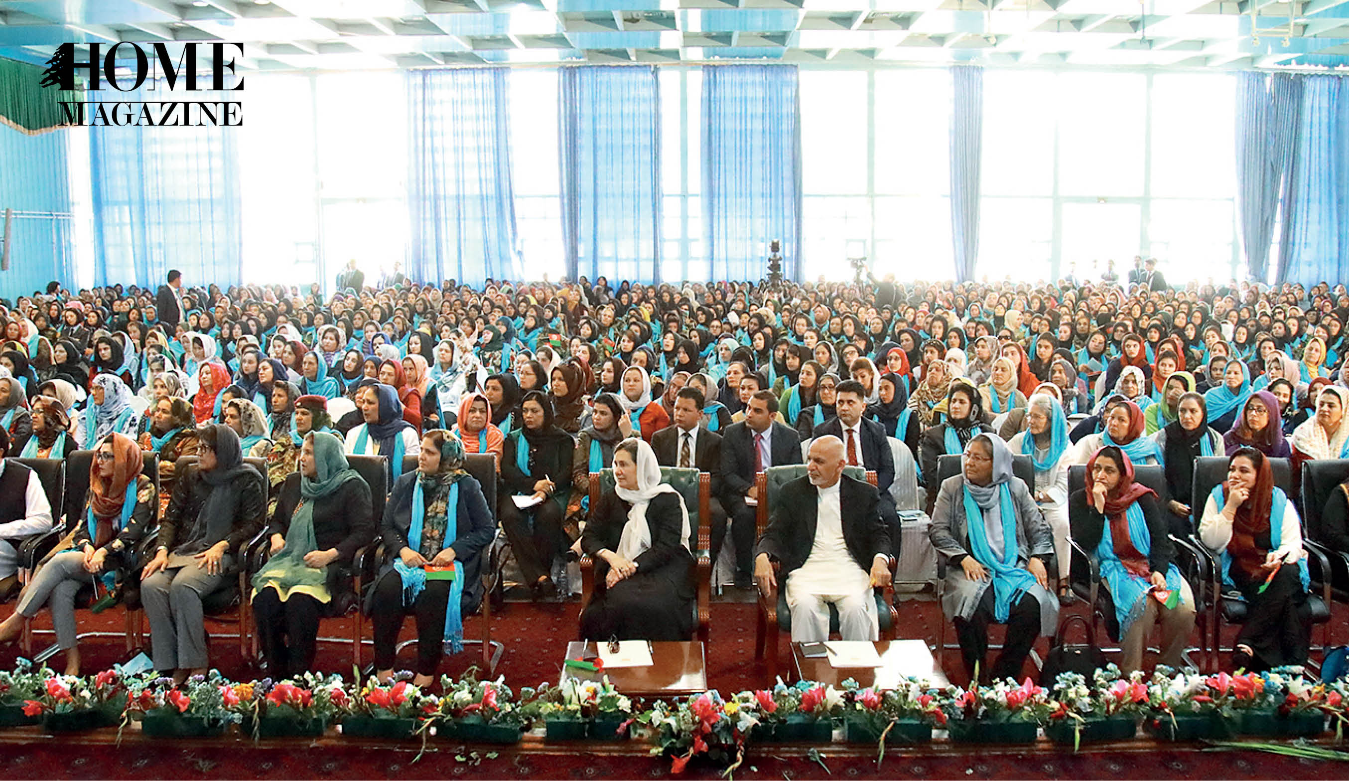 Crowd of seated men and veiled women