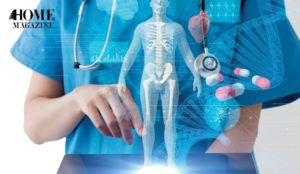 Human skeleton illustration in the hands of a person wearing a blue shirt