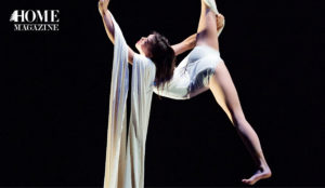 Girl swinging on white rope