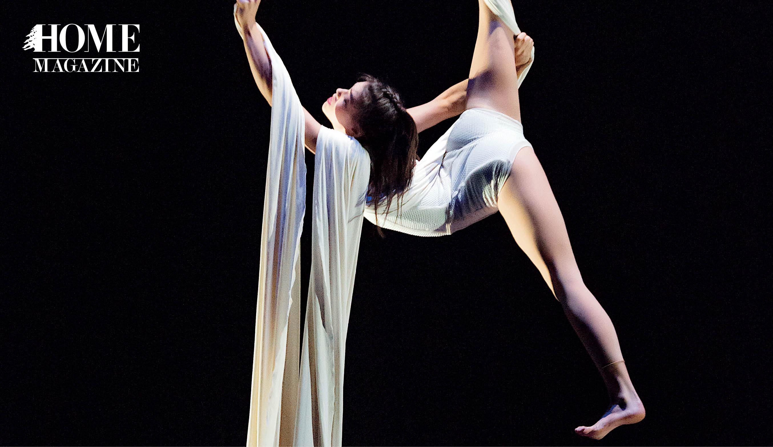Girl swinging on white rope