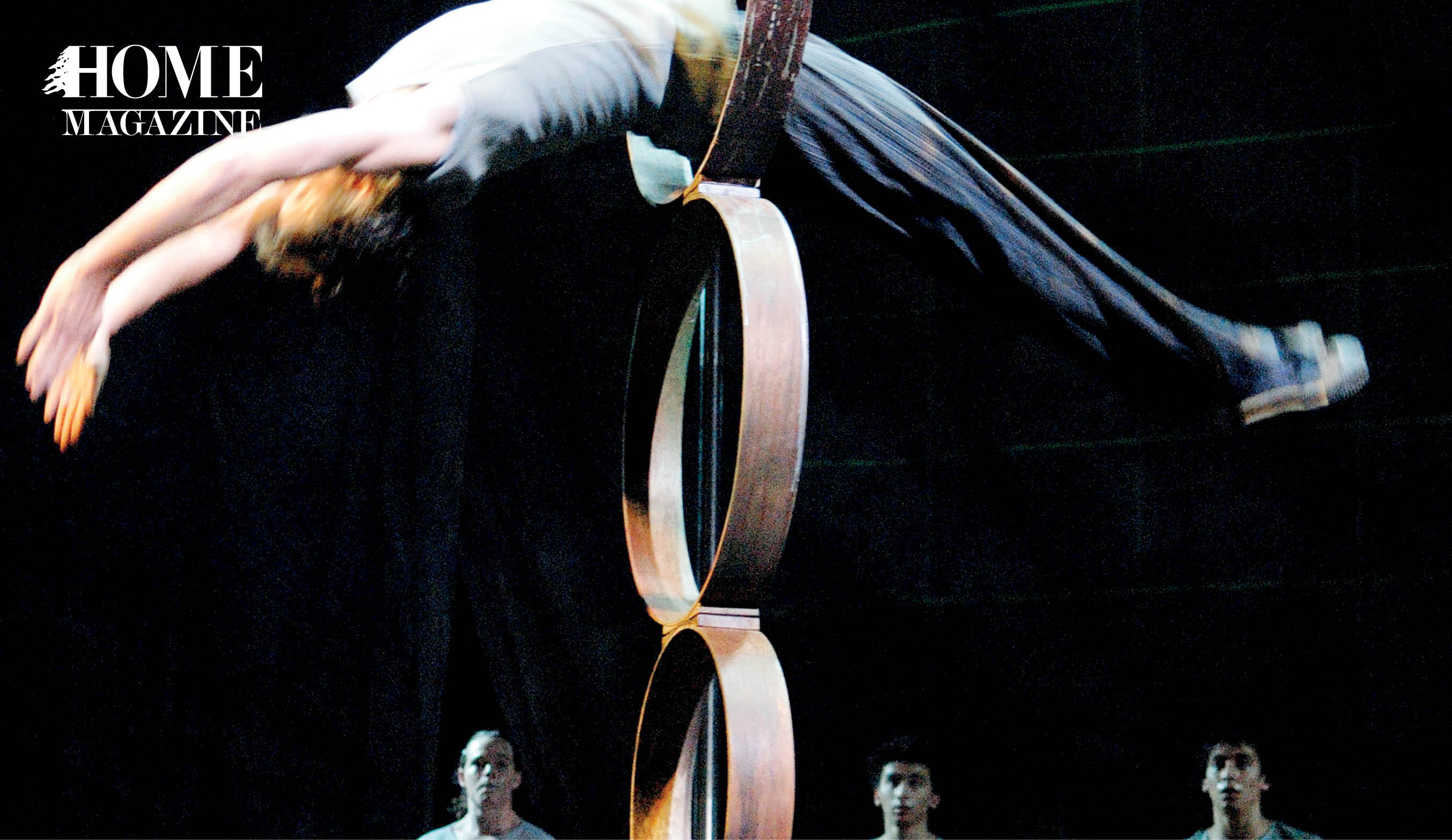 Man swinging between circles