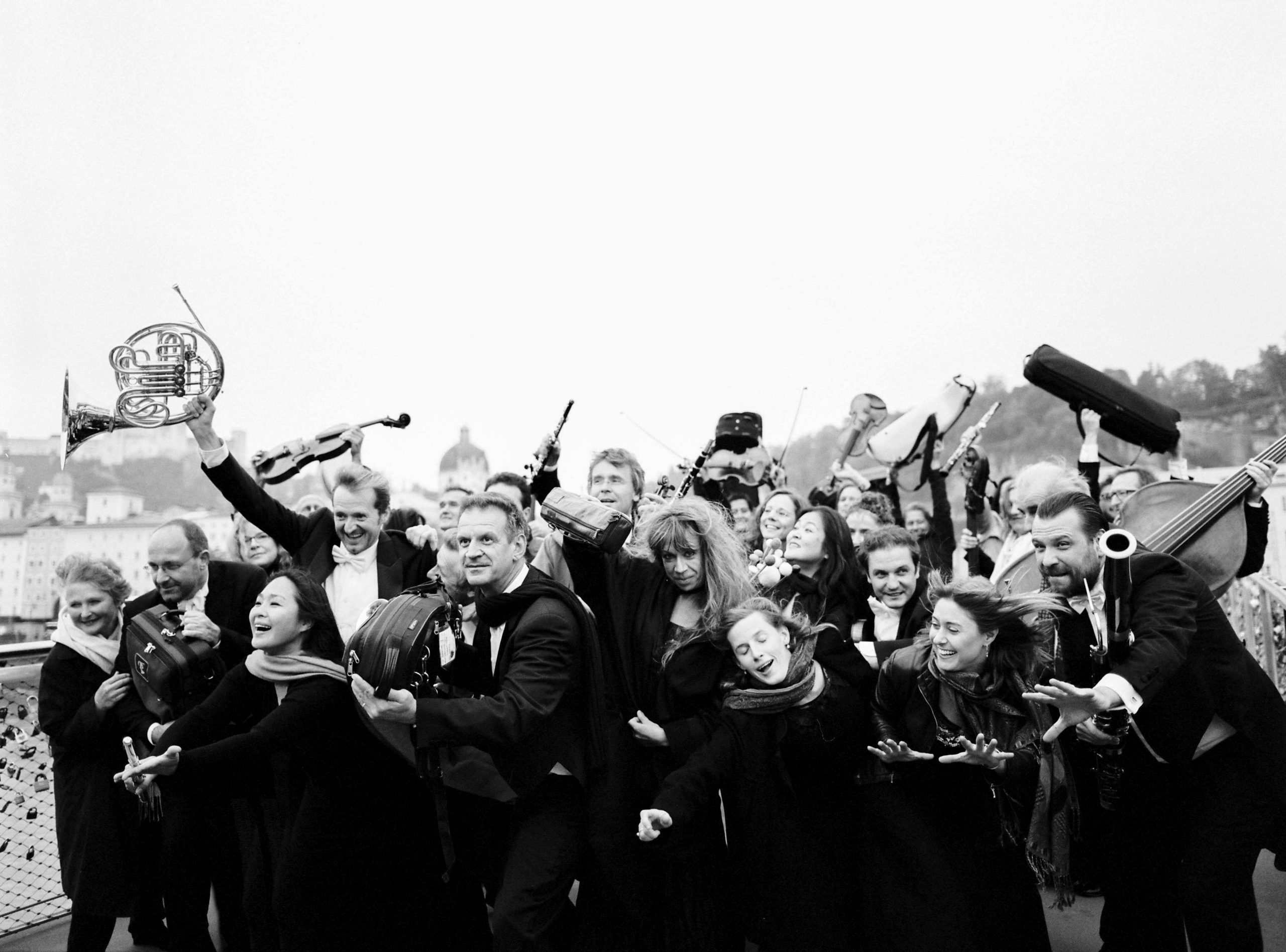 people all holding different instruments