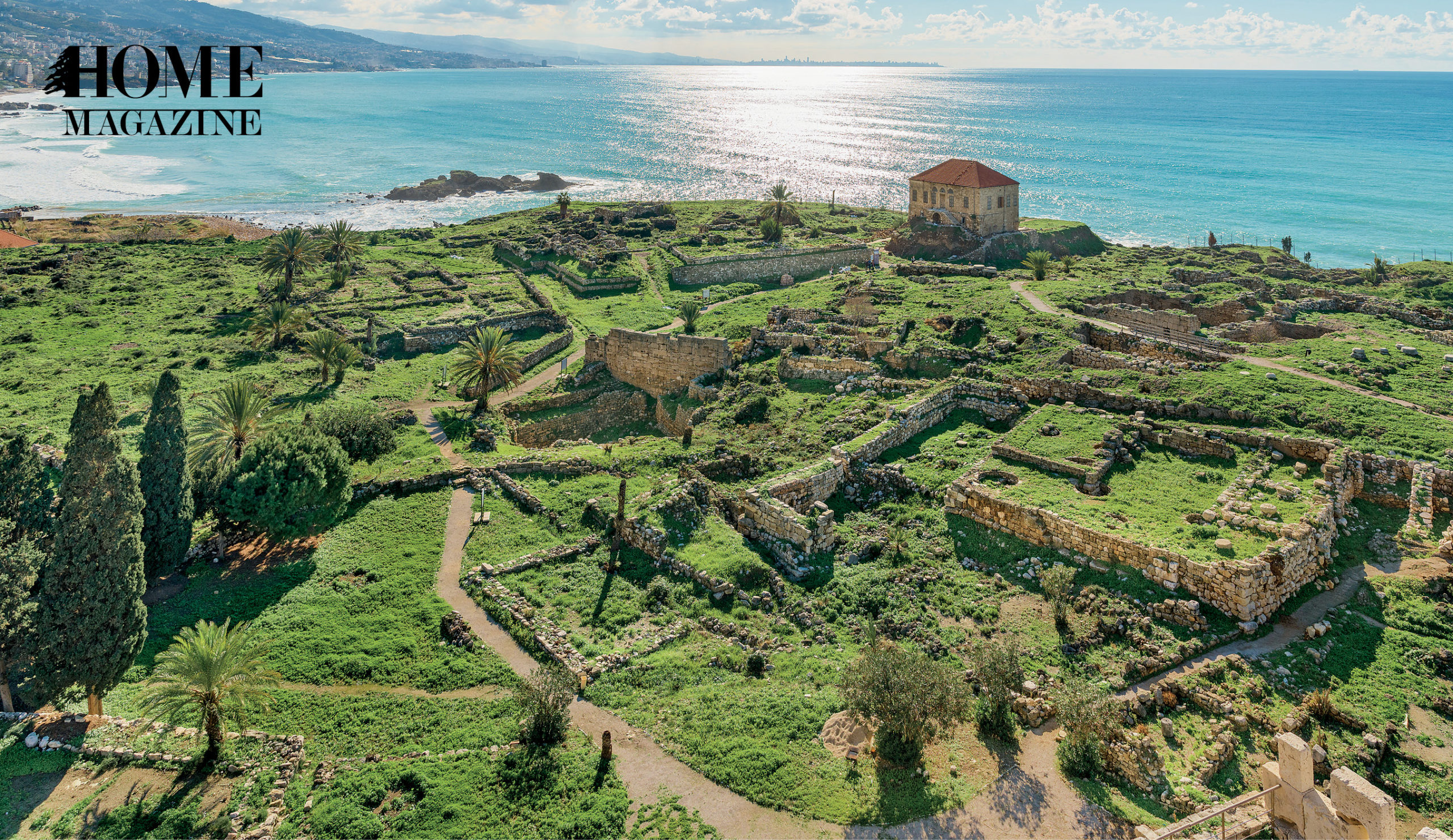 Scenery of a house on green land and blue sea ahead