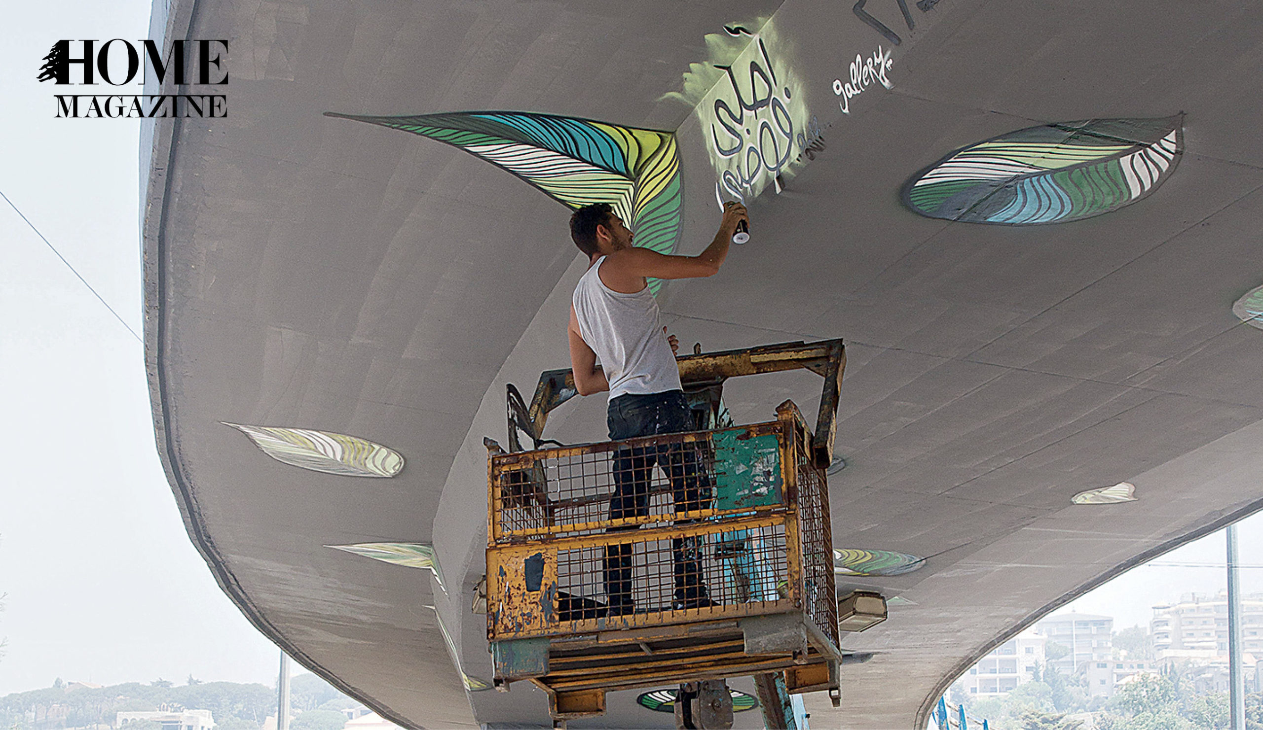 Man painting on bridge