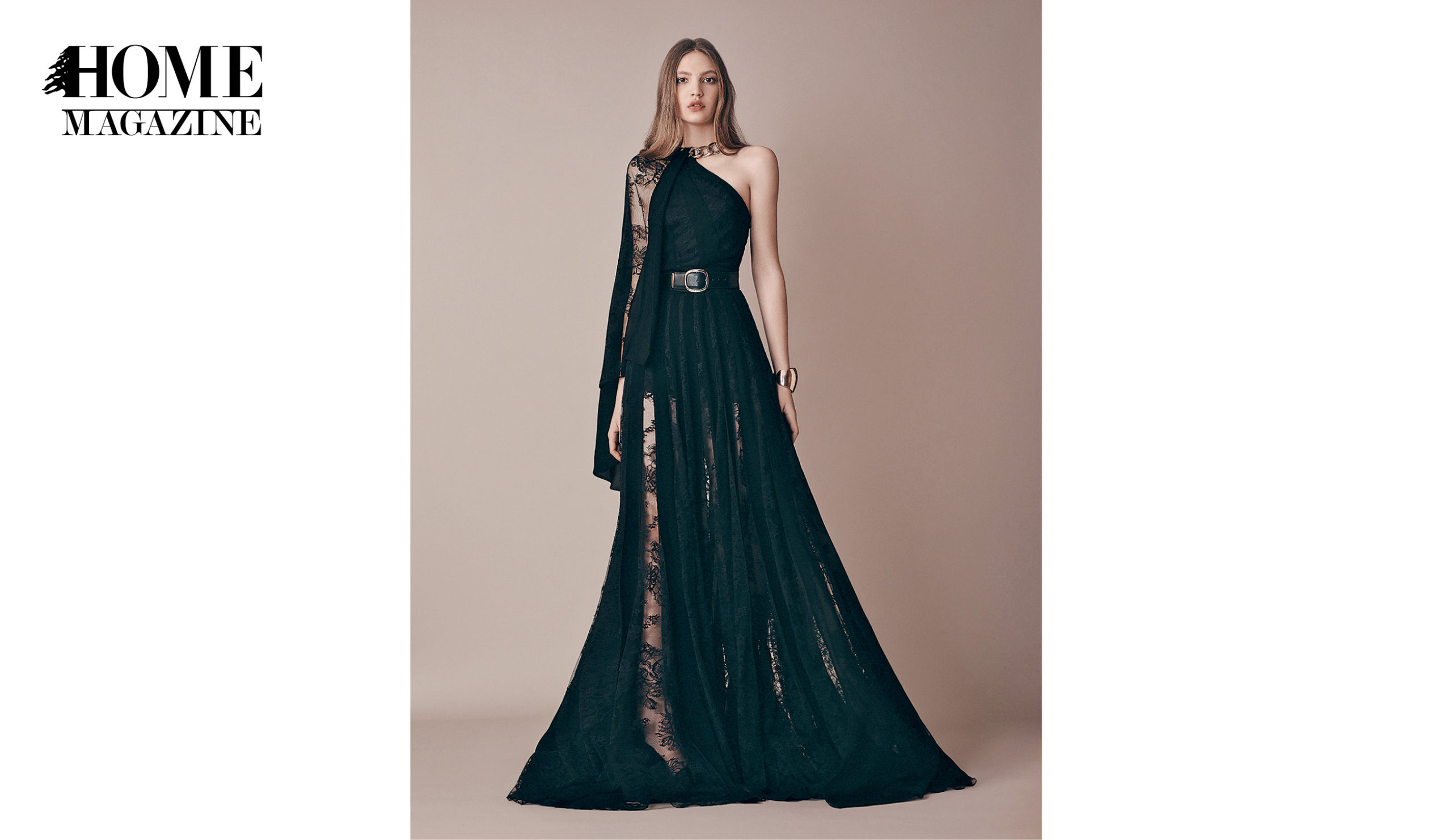 Model wearing black one sided dress with lace