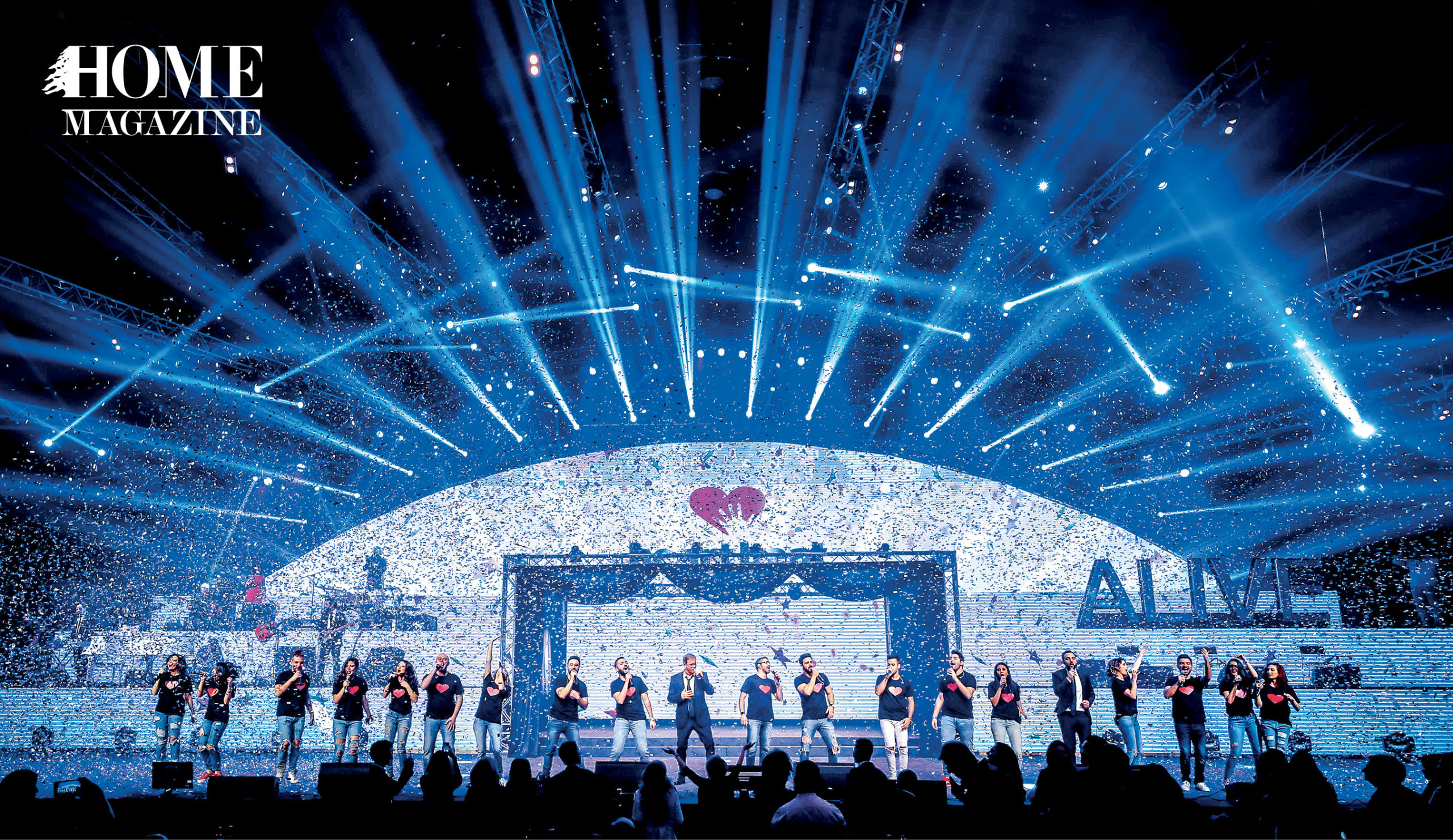 Group of people performing on a stage with blue lighting