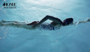 Swimmer in blue water