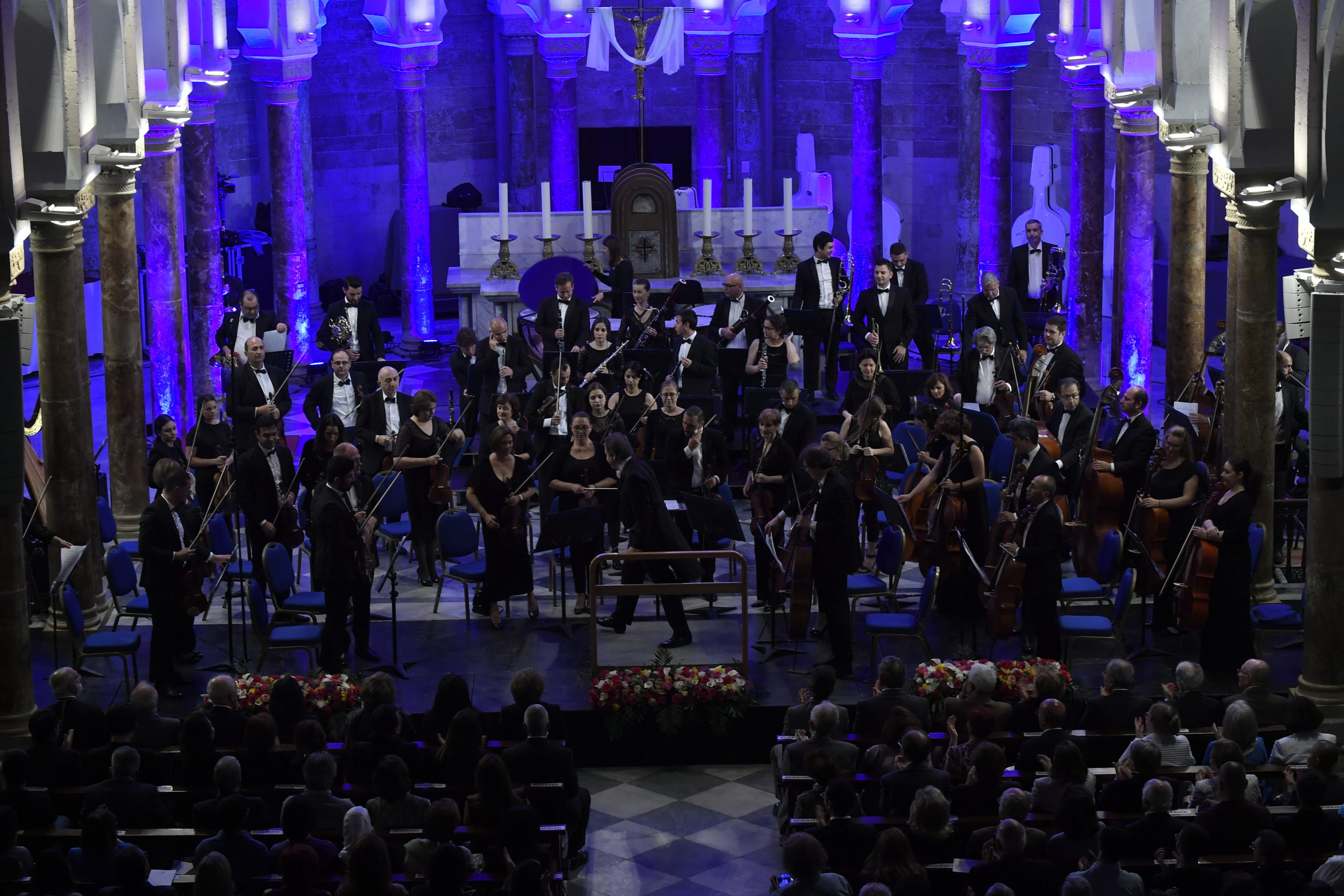 an orchestra with lots of people