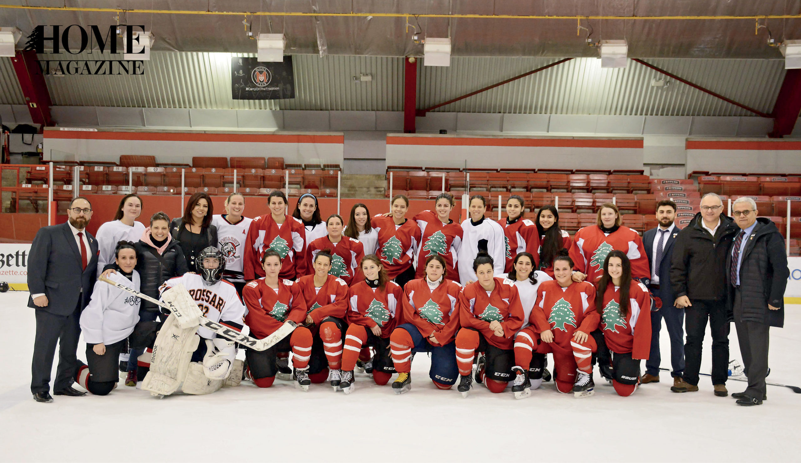 Group of students mostly in red costume