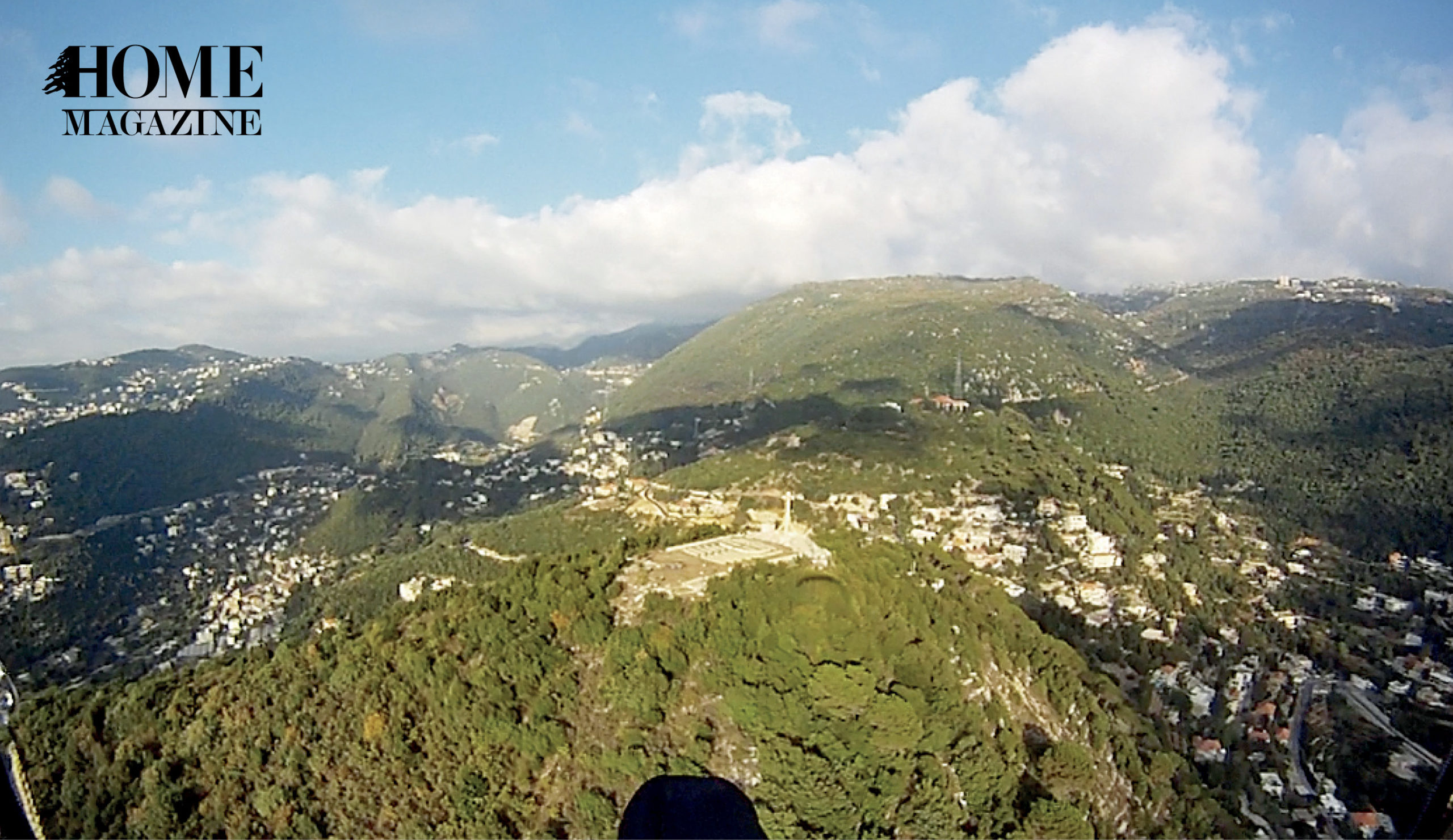Green mountains and blue sky with clouds