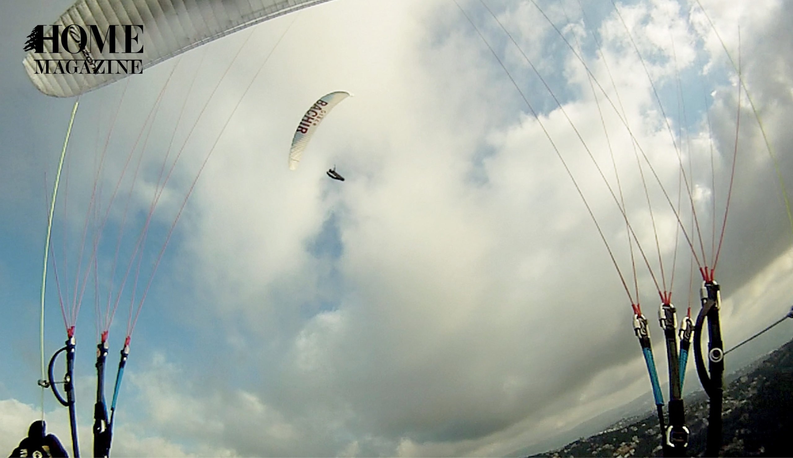 A parachute amidst sky and grey clouds