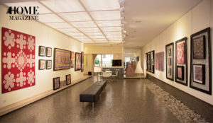 A room with paintings hanging on walls