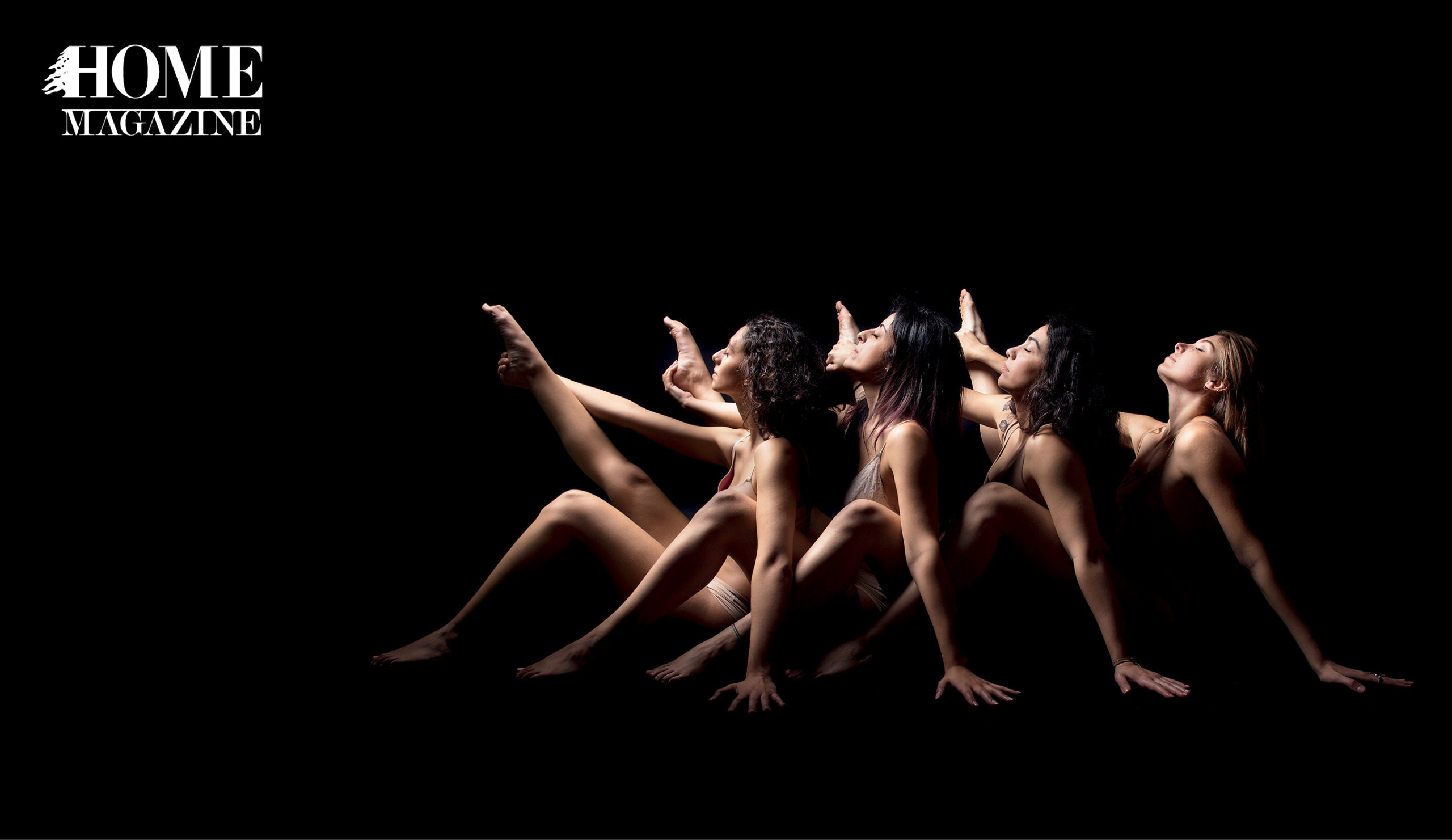 Four women stretching in the dark