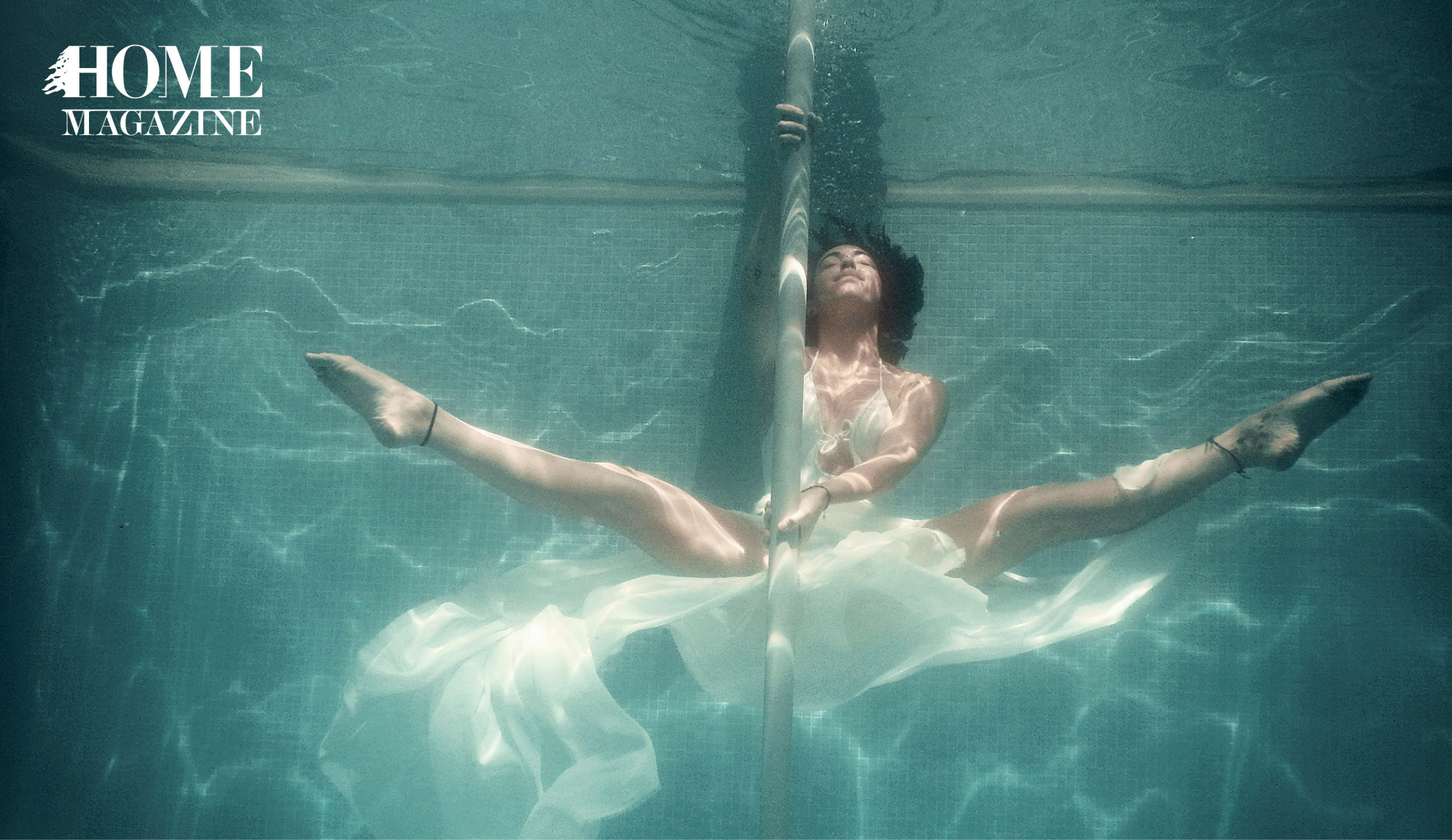 Woman hanging on a pole in waters