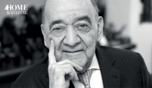 Portrait of a bald man in a suit