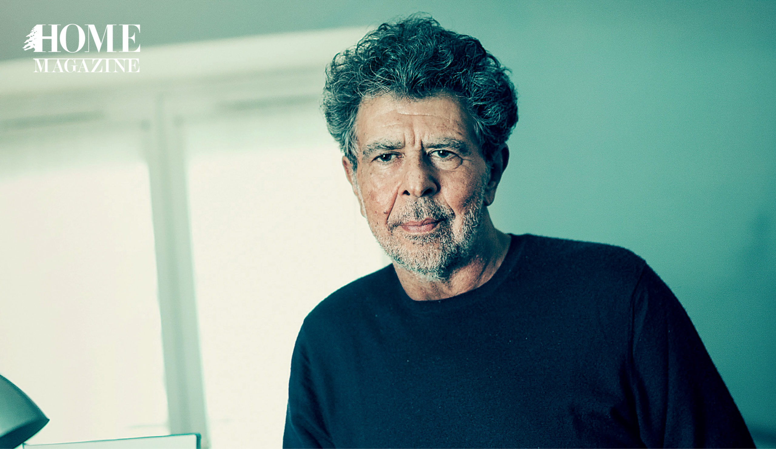 Man with curly hair in black shirt