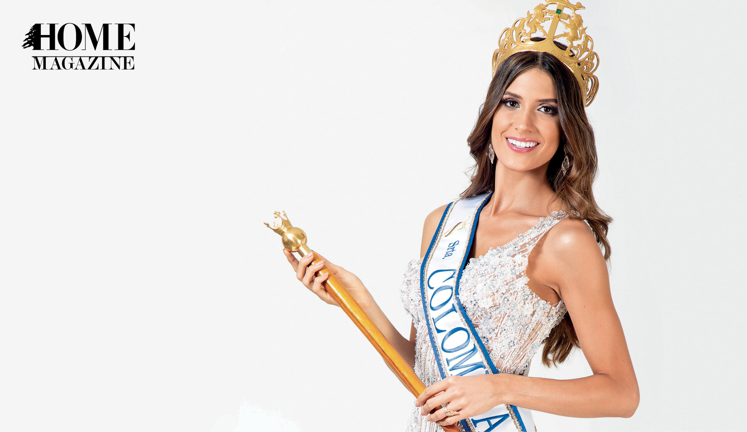 A woman wearing a crown and holding a crown stick