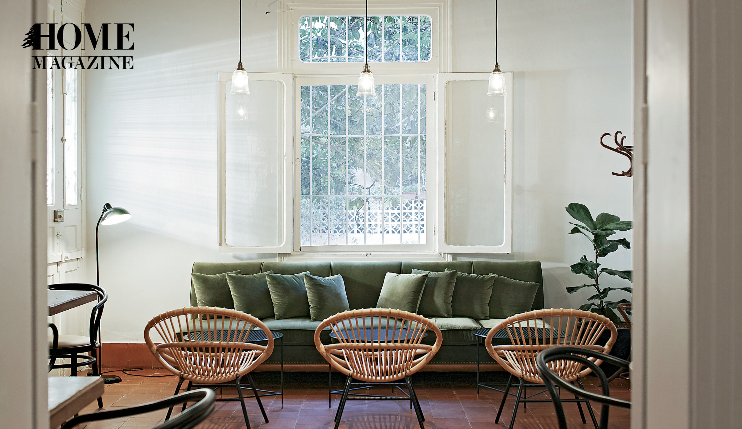 Indoor space with green couch and 3 chairs