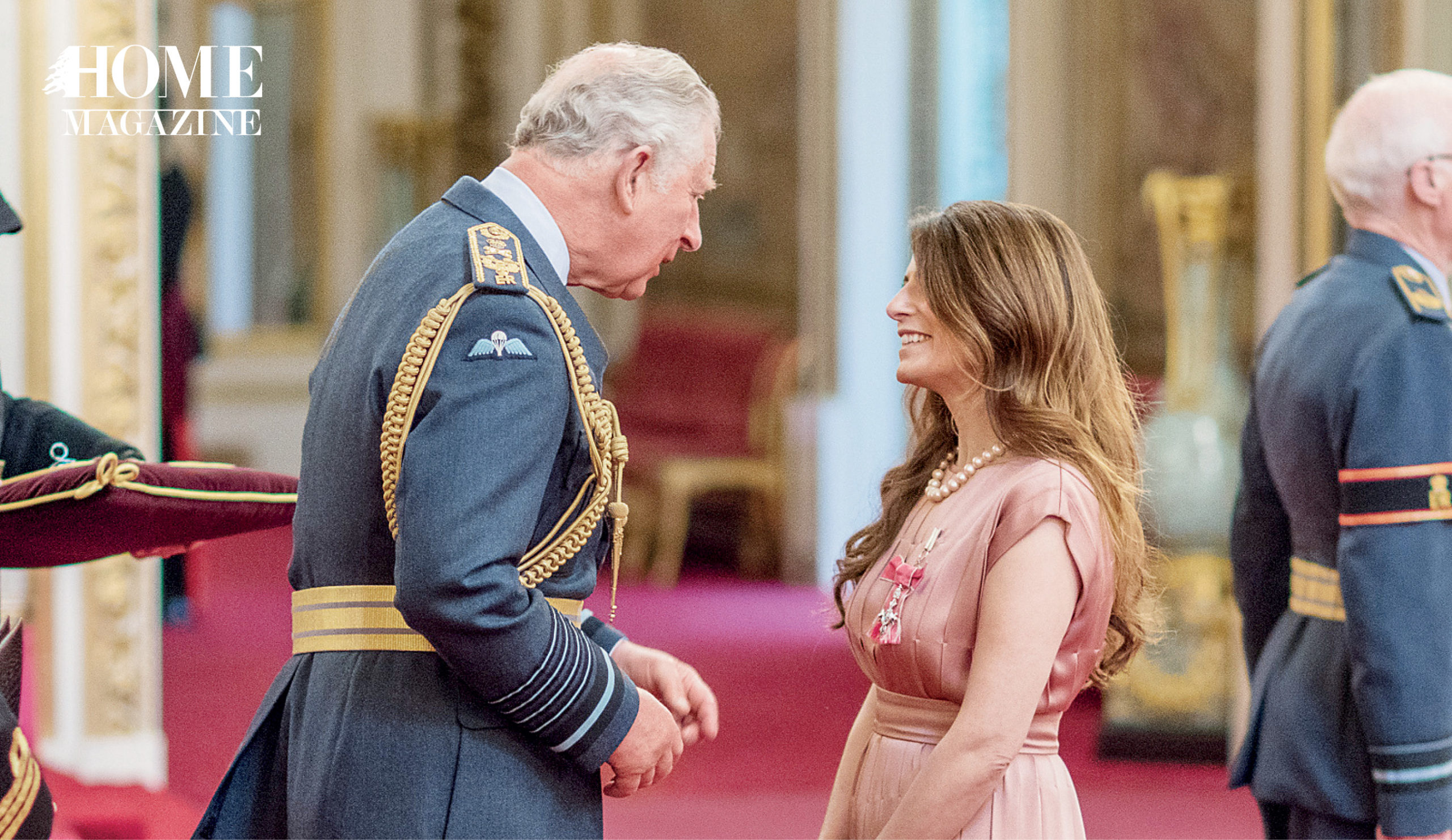 A woman in a pink dress and a man in military suit