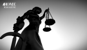 a statue of a women holding the balance of justice